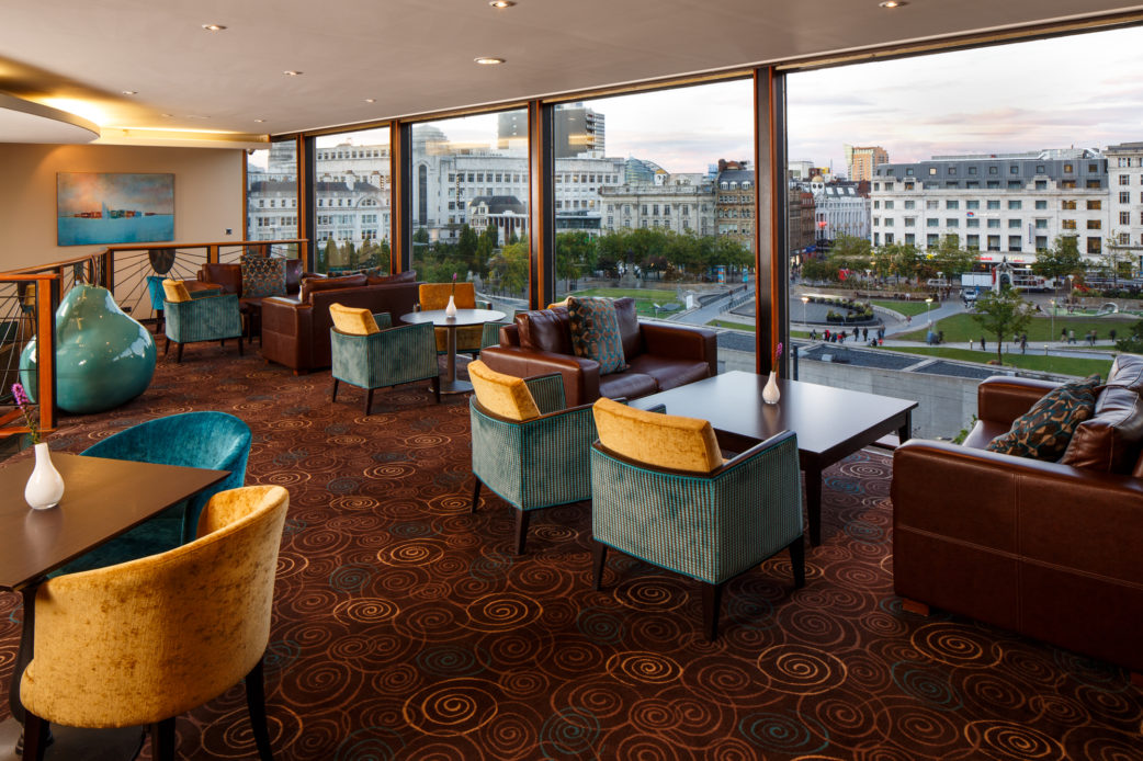 mercure-manchester-piccadilly-hotel-bar-04-lr-210915 The lounge with a view out of the window over Manchester at mercure manchester piccadilly hotel