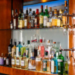 Bottles of spirits on shelves behind the bar at mercure manchester piccadilly hotel