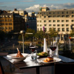 Meal on a table with a view out of the window in the restaurant at mercure manchester piccadilly hotel