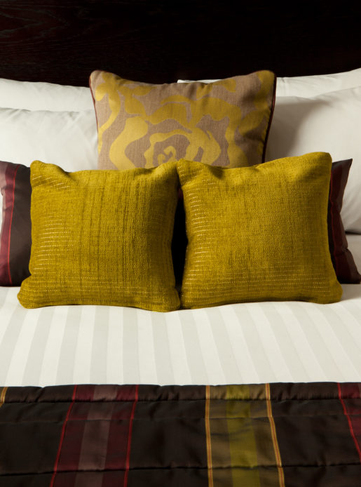 Pillows and cushions on a bed at mercure manchester piccadilly hotel