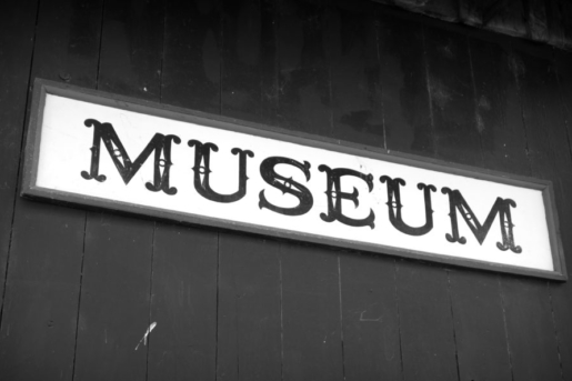 black and white museum sign