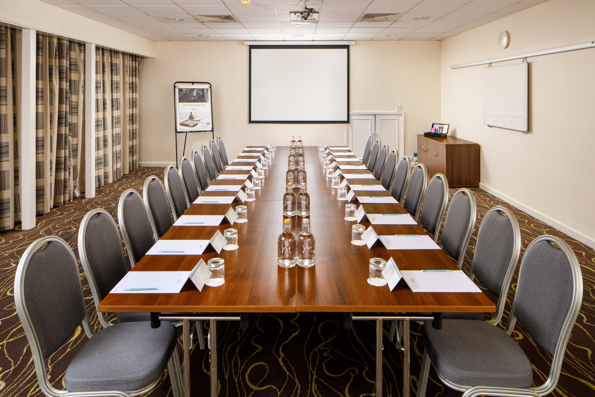 Mercure-Manchester-Piccadilly-Hotel-Park-Avenue-Meeting-Room-01-lr-080320 Tables set for private dining in the senate room at mercure gloucester bowden hall hotel