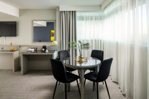 Round table and four chairs located in the lounge area of the superior room at Mercure Manchester Picadilly