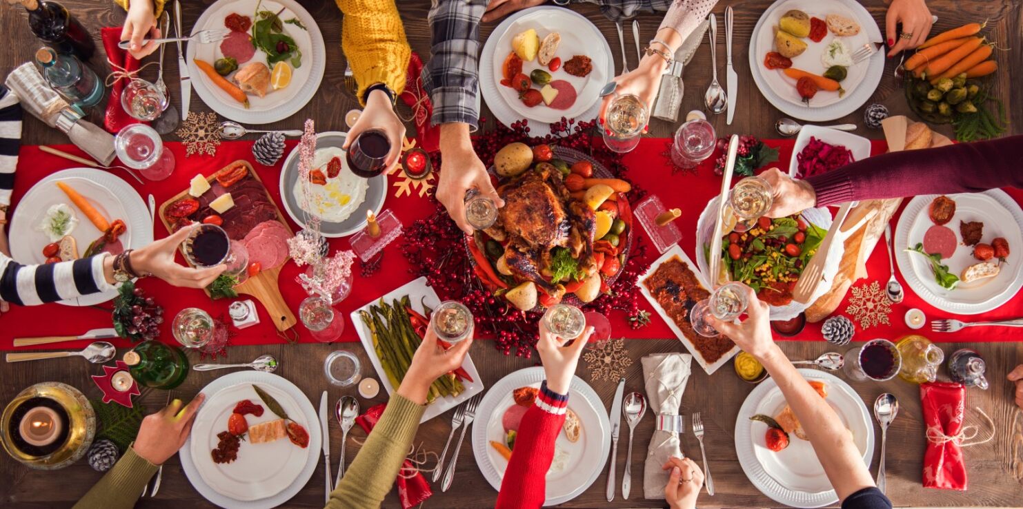 family sitting round or meal at restaurant